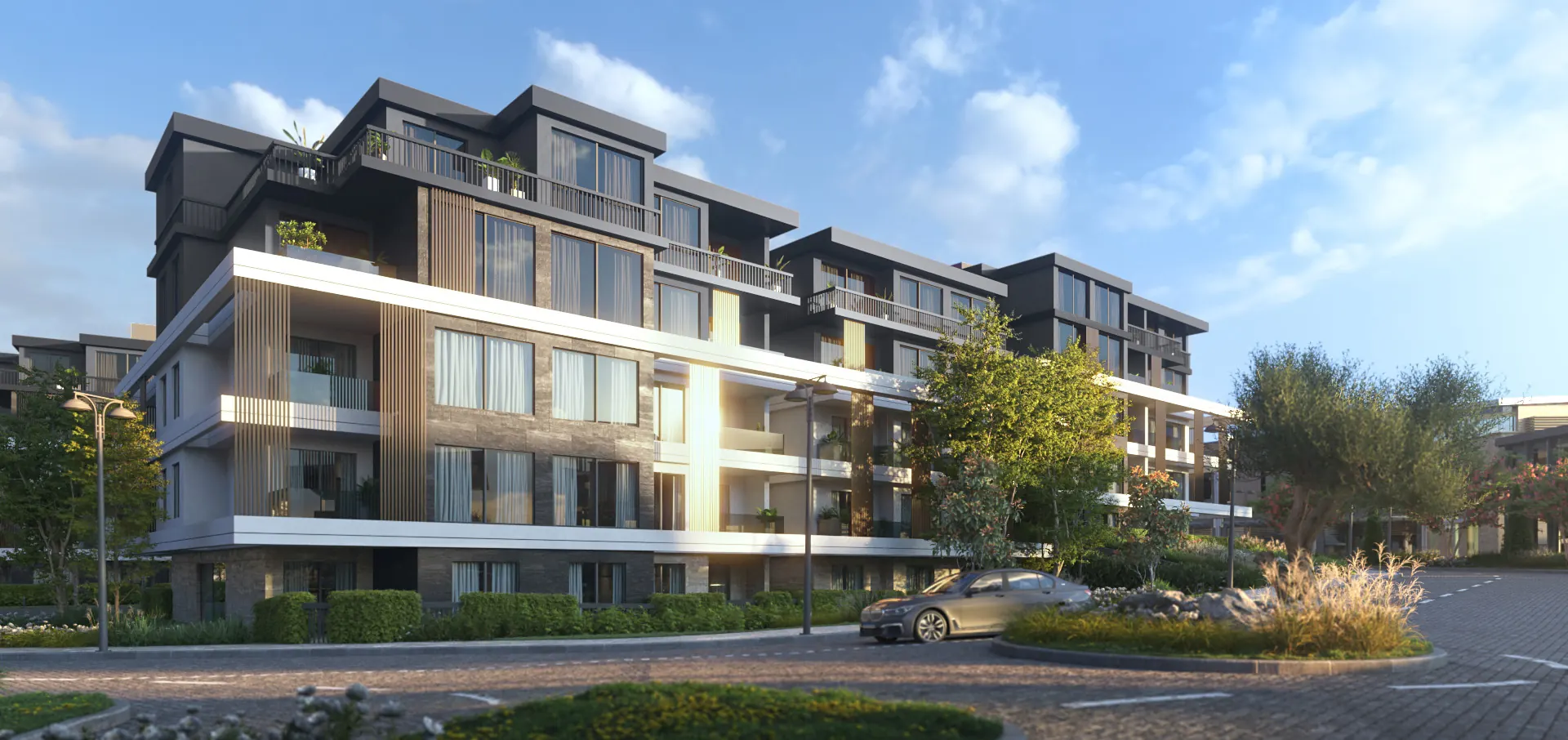 U.Nurai residential building with balconies and a timber-clad façade beside a landscaped street