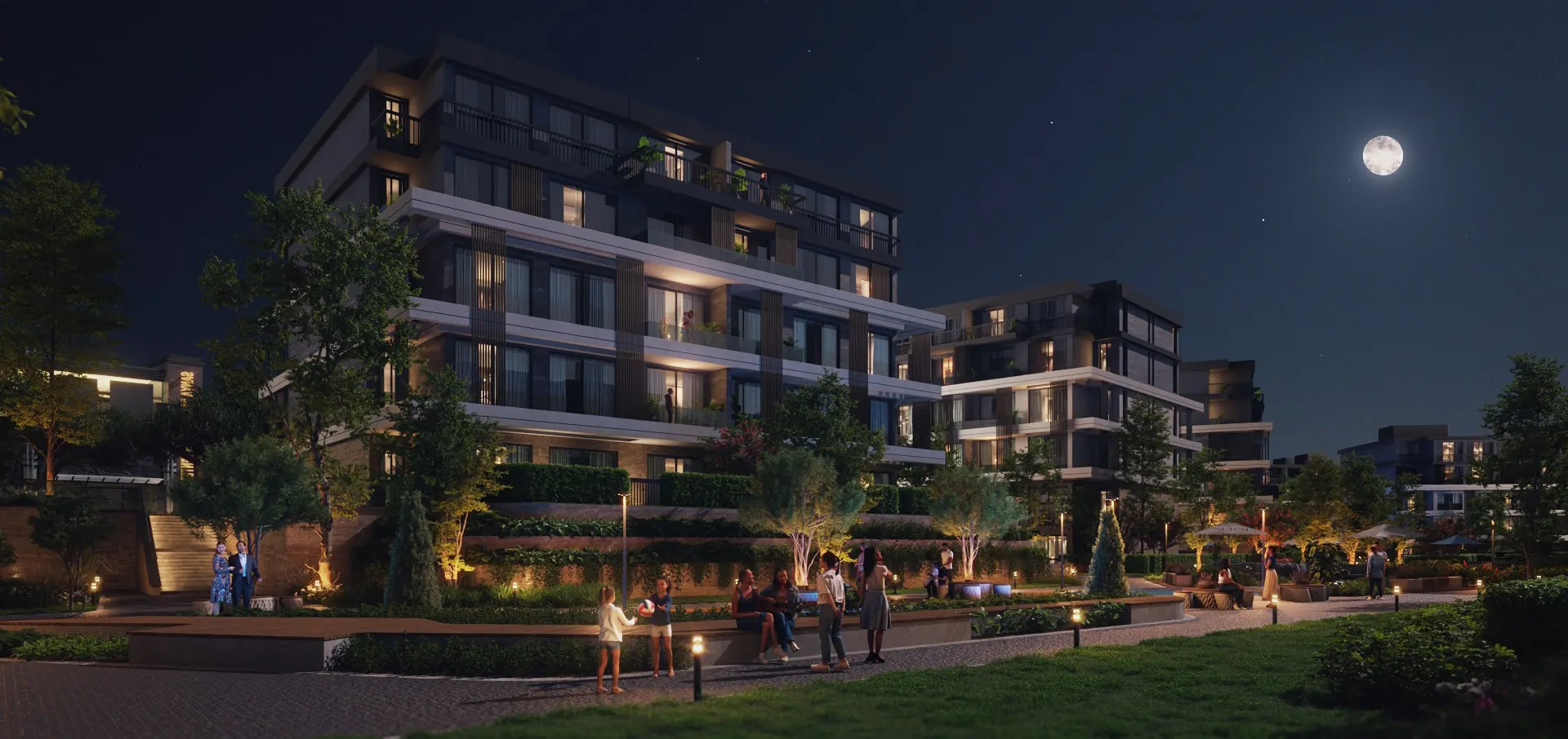 Residential buildings and gardens of U.Nurai lit at night