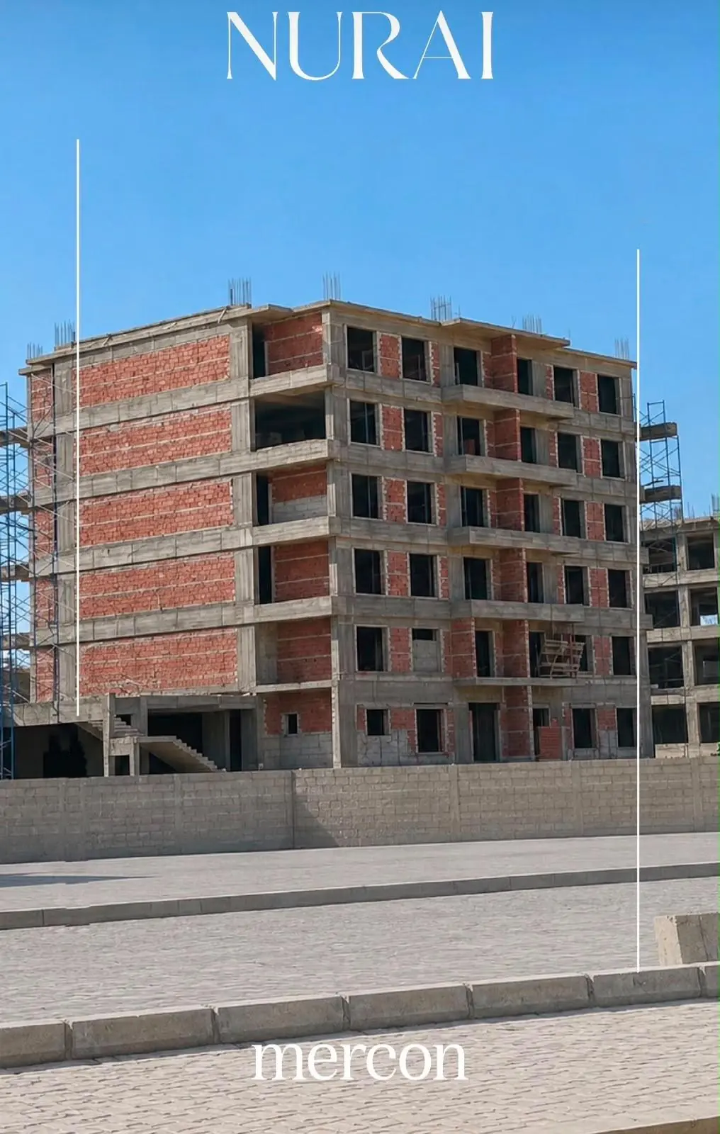 Residential building under construction with red brick walls at the U.Nurai site